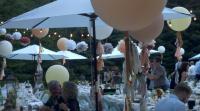Large Balloons, Tissue Poms, Bistro Lights and Market Umbrella's create the atmosphere!